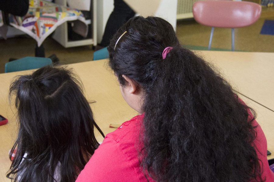 Mother Alejandra Garcia and her daughter participate in arts and crafts in The Mother and Child Program at The Living Room. 