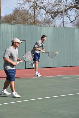 Bear Cubs men’s tennis members get set during a practice match.