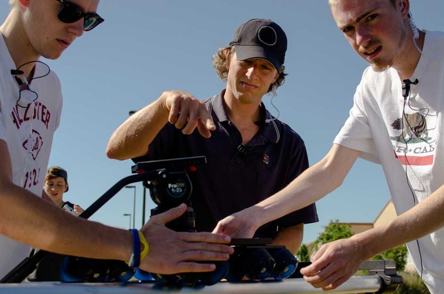 Brian Antonson works and instructs students during an onsite shoot for his introduction to filmmaking class.