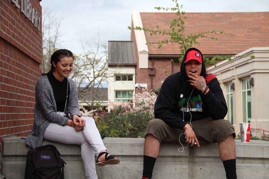 Spring weather makes friends and SRJC students Chris Hernandez and Sayra Gomez more inclined to mingle in the quad.
