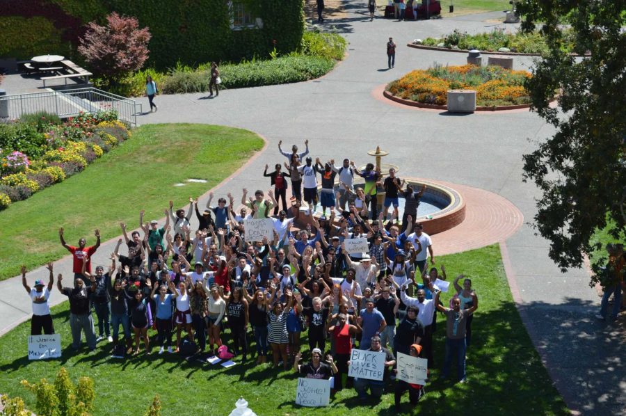 Students, faculty and the Black Student Union raise awareness of violence toward black citizens. People hold  signs such as “Black Lives Matter,” in support of the movement. 