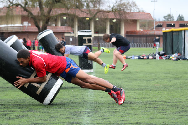The Santa Rosa Junior College rugby club performs tackling drills during a practice March 3. The rugby club continues its hard work to prepare for games despite their low fan turnout.