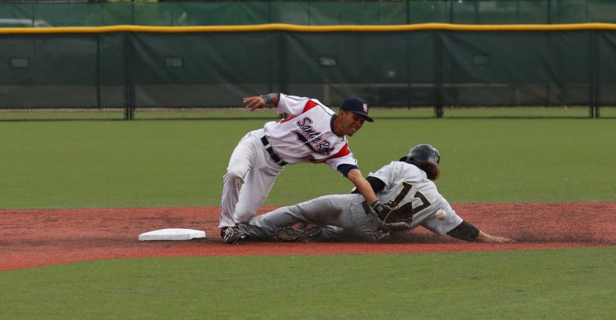 Santa Rosa Junior College second baseman Myles Andrews attempts to tag out a San Joaquin Delta runner trying to steal second base. SRJC captured its first conference championship since winning the  Big Valley Conference in 2005, on its way to winning the State Championship.