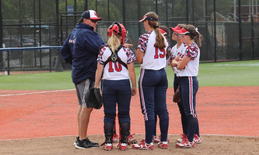 SRJC softball head coach Phil Wright makes a visit to the mound to discuss the team’s strategy for the next batter in a game against San Joaquin Delta College April 21 at Marv Mays Field. The SRJC softball team currently has a 7-11 record in conference play and an overall record of 18-18. 