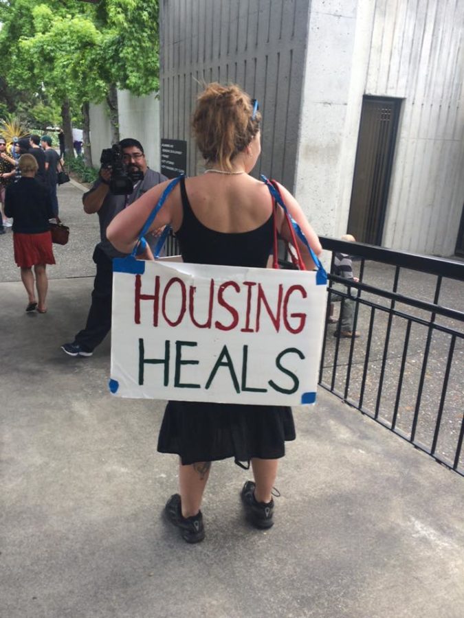 Rent control protestors sported signs in support of their cause.