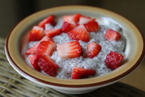 Cubed strawberry garnishing a bowl of tapioca-esque chia seed pudding