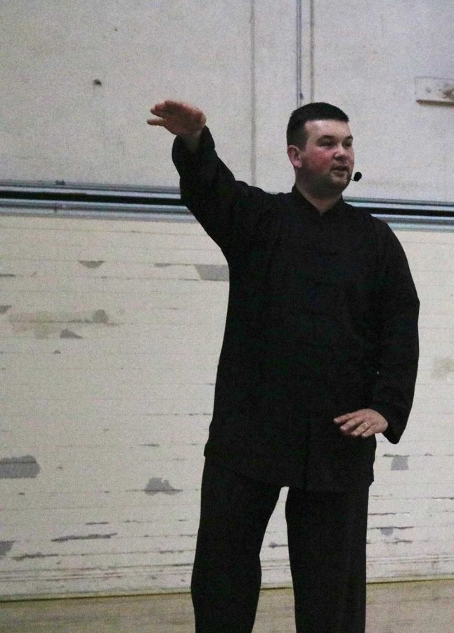 Shifu Justin Eggert instructs his students in breathing and balance techniques to deepen their understanding of how to move freely and maintain their center of gravity.