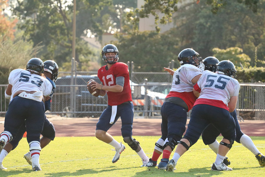 SRJC sophomore starting quarterback Mitch Hood scans the field during a team scrimmage Aug. 20.