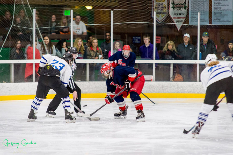 
Polar Bear center Larry Hansen takes a face off against a UC Davis skater in the 2015 Pacific Collegiate Hockey Association championship.