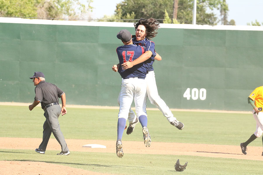 Santa Rosa Junior College first baseman Ryder Kuhns  and pitcher Alec Rennard celebrate after recording the final out at the 2016 state championship.