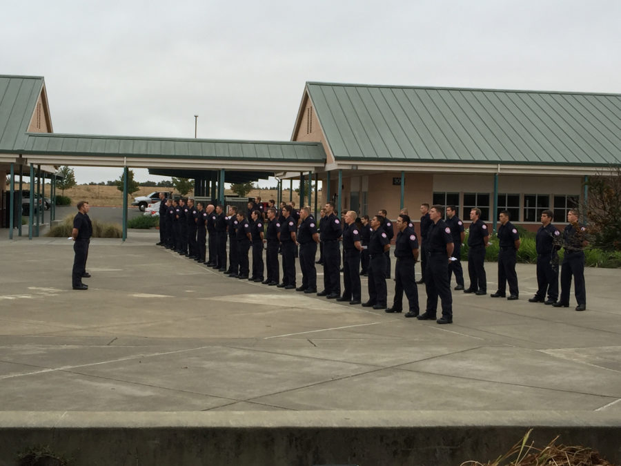 SRJC firefighter trainees stand at attention during the reading of the names of fallen firefighters on Sunday Sept. 11.