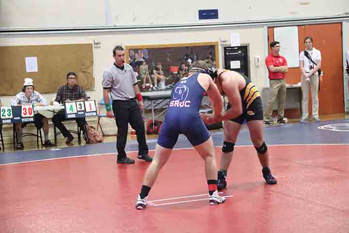 SRJC sophomore wrestler Paris Henry fights for position in his winning match against a Chabot College wrestler.