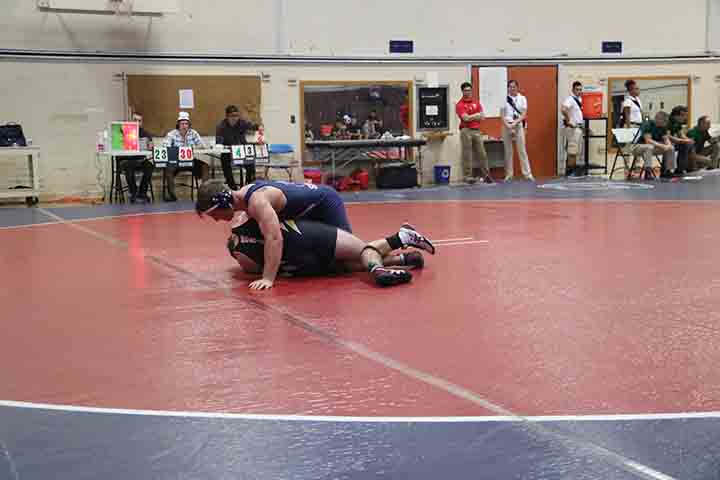 Paris Henry drops his opponent from Chabot College and maneuvers to get him pinned.