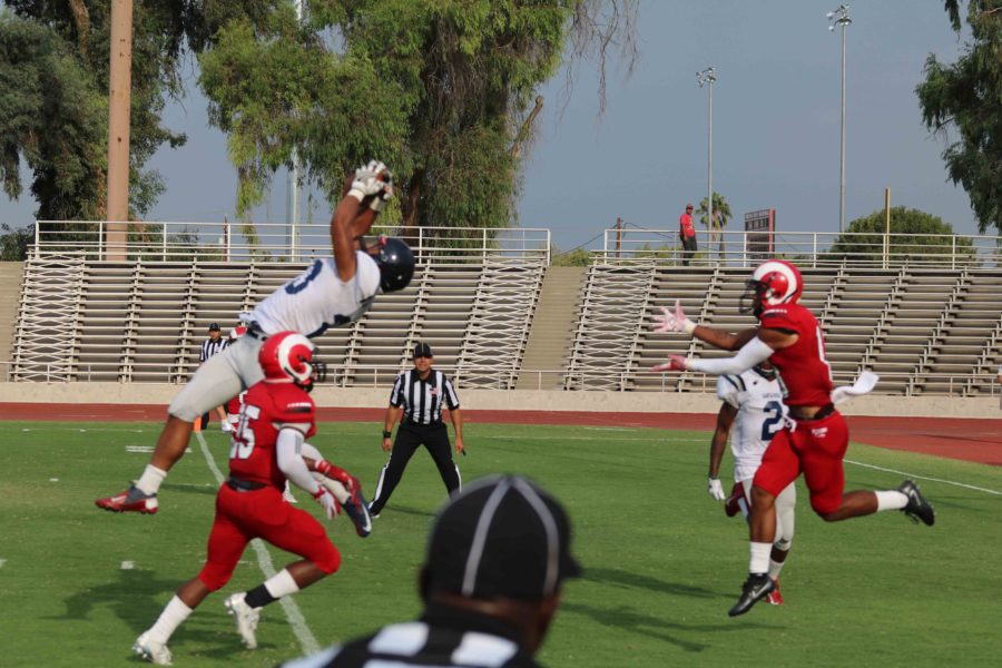 Sophomore defensive back Justin Tauaefa extends his body and grabs one of the five interceptions by the Bear Cubs defense on Sept.10.