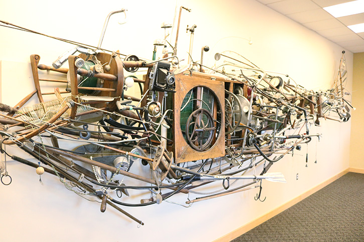 “Whale Sculpture” by Monty Monty, located on the top floor of Doyle Library, was hung in 2006 with the help of SRJC art instructor Michael McGinnis. The piece encompasses a collection of random items, including a chair, pulleys and wheels, beads, and a number of fishing poles. 