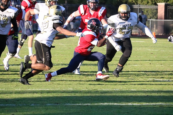 Santa Rosa Junior College running back JaNarrick James cuts through two San Joaquin Delta defensive players in a blowout 55-23 SRJC victory Sept. 17 at Bailey Field.  