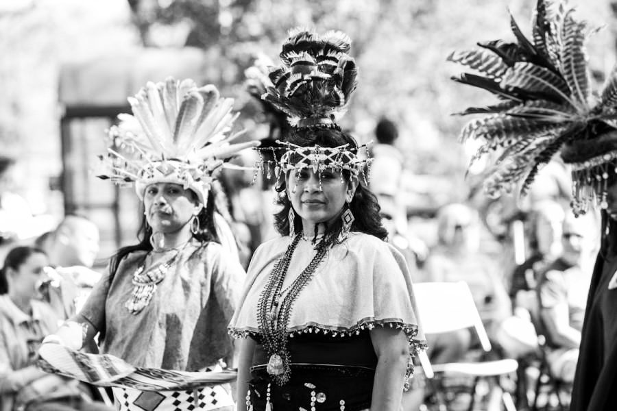 Native American performers in traditional dress at Indigenous People's Day in 2015.