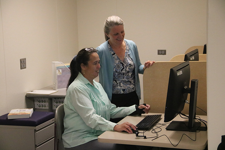 HOPE program director Jeannie Dulberg, right, with a new student, wants to see more minority students enter professions like nursing and medical assisting.
