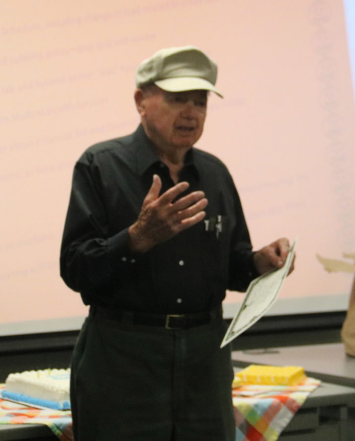 Bill Michell stands in front of a group of his colleagues thanking them for his surprise 90th birthday party on Oct. 7. 