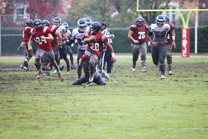 Sophomore running back Zach Smith fights through tackles in the Bear Cubs 17-7 win in the Gridiron Classic Bowl on Nov. 19. Smith rushed for over 200 yards and was named MVP of the game.