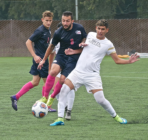 SRJC midfielder Henrique Noujeimi fights through opponent and attempts to steal the ball in the Bear Cubs 3-1 victory on Oct. 28.  