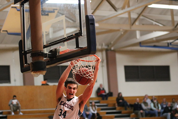 Forward John McMillan slams it in on a fast break in a 64-40 win over Sierra College on Jan. 24.