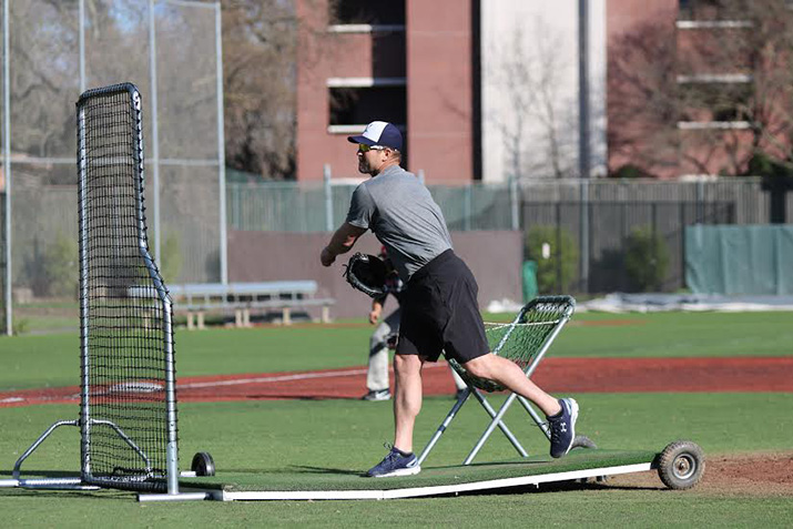 Former Bear Cub and Major Leaguer Jason Lane throws batting practice to the Bear Cubs on Jan. 24. Lane played for the San Diego Padres and Houston Astros during his career and currently is the assistant hitting coach for the Milwaukee Brewers.