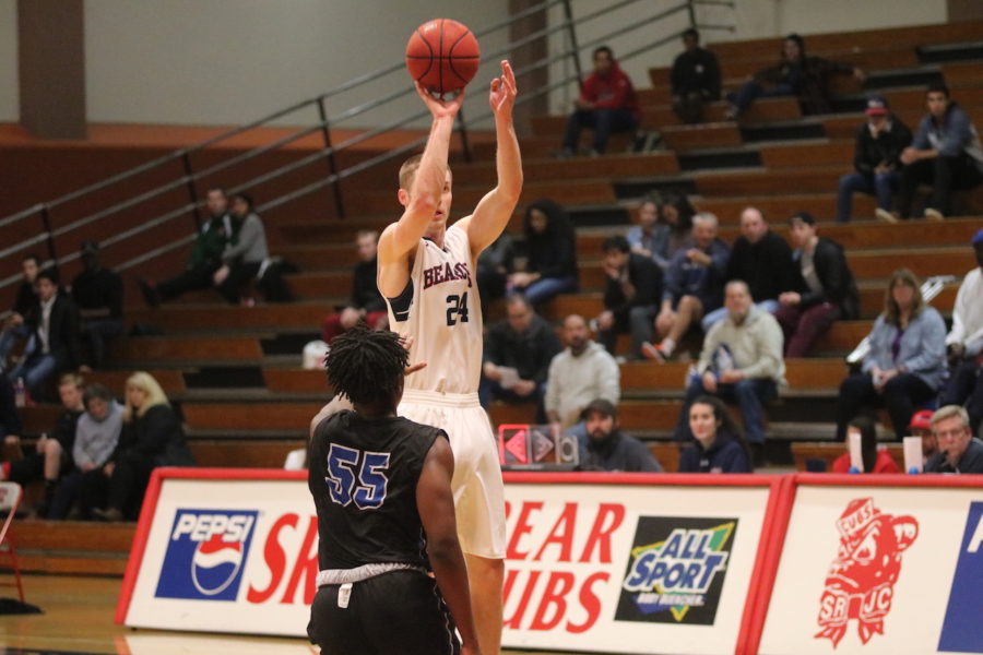 Sophomore guard Kiel Long shooting a basket from behind the arc