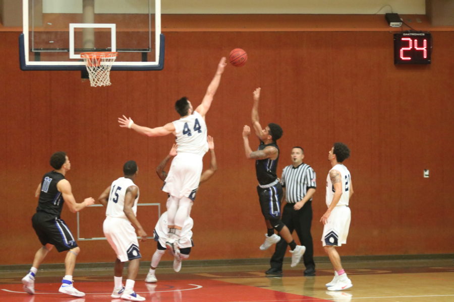 Sophomore forward Jon Montez blocking a shot 