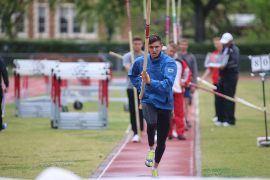 Adam Gockel approaches the mark for pole vault.