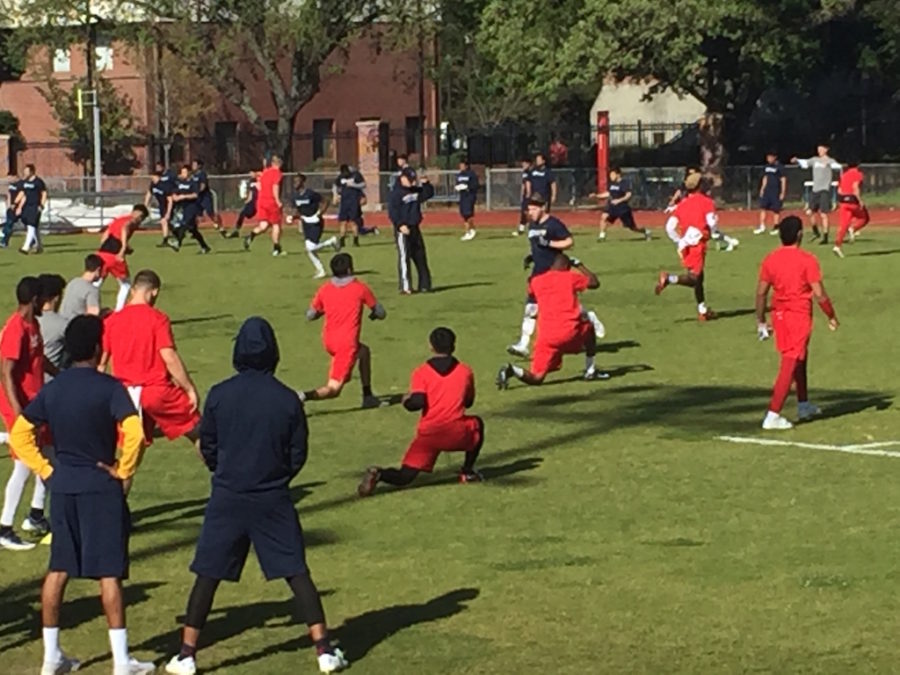 SRJC football warms up before competing against each other in the 2017 Spring Olympics.