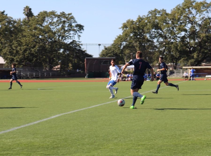 Santa Rosa Junior College freshman Owen Mccabe pushes the ball up the field attempting to seal the Bear Cubs 2-1 win over Merritt College on Sept. 19 in Santa Rosa.