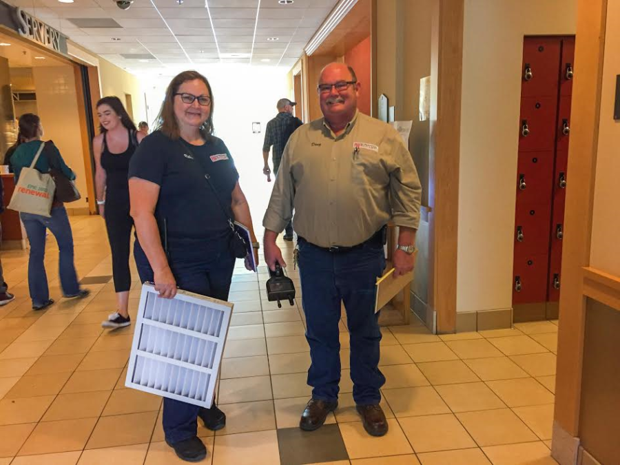 Santa Rosa Junior College Environmental Health and Safety staff, Robin McHalle
and Doug Kuula, work hard to change filters and monitor air quality. PC Roberta MacIntyre