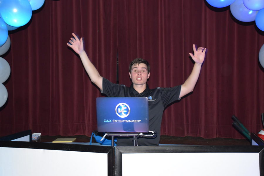 DJ Dustin having a blast behind the turntables as he prepares for a show.