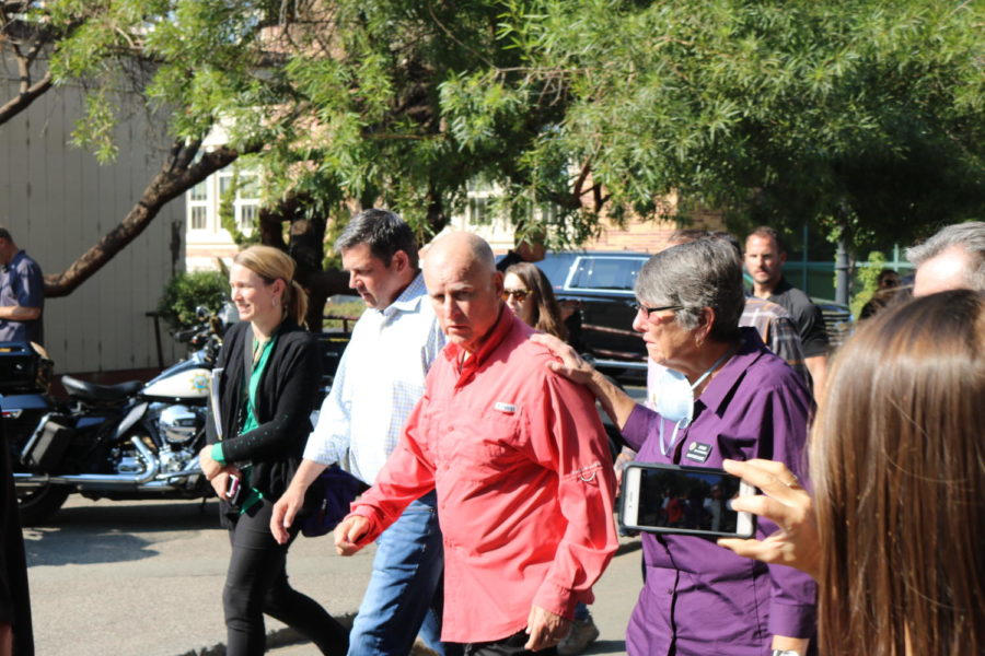 Governor Jerry Brown walks into the Santa Rosa High School gym to address the community with Senator Diane Feinstein and Senator Kamala Harris. 