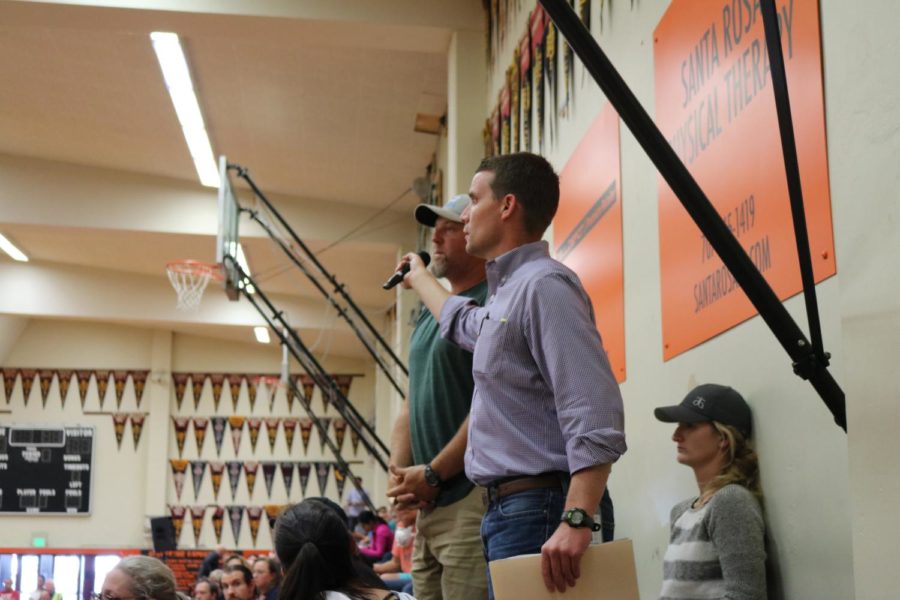 Senator Mike McGuire ran all over the Santa Rosa High School gym offering the microphone to community members who had pressing questions for emergency officials on Oct. 14.  