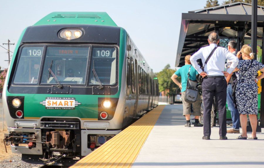 SMART train officials direct passengers to their designated trains. 