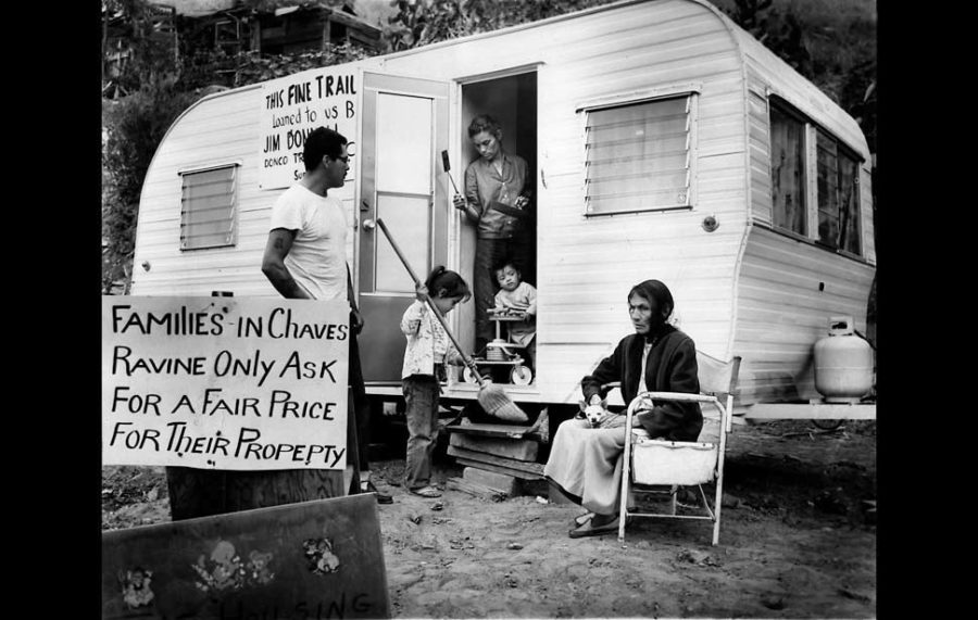 May 13, 1959: After having their homes destroyed by bulldozers, Chavez Ravine residents Manuel Augustine, left, Ivy Augustine (sweeping), Ira Augustine (baby), Victoria Augustine (woman in doorway) and Abrana Arechiga lived in a trailer.