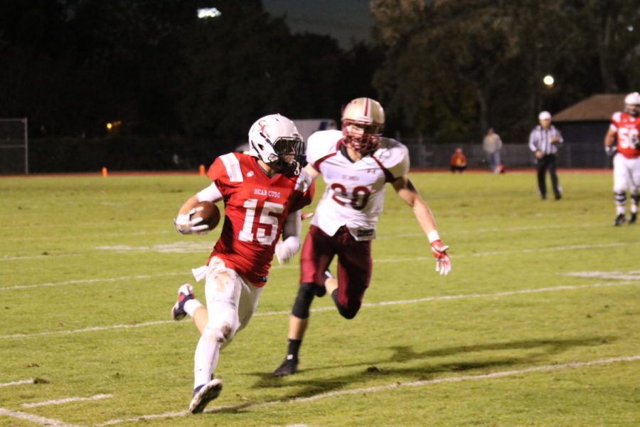 Bear Cubs quarterback Zack Hugh runs for a  first down en route to an overtime 39-32 win in the season finale against De Anza College.