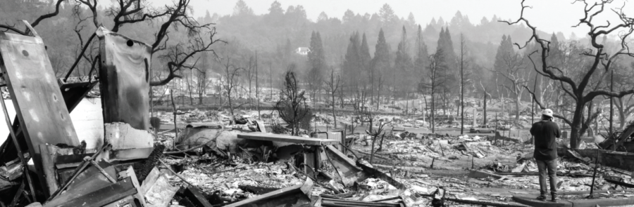 Co-Editor-in-Chief James Wyatt shoots footage of the devastation from a fallen shopping center in Fountaingrove as the ashes still smoldered on Oct. 10.