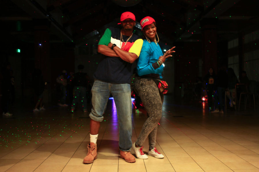 Umoja Team founders Regina Mahiri (right) and Byron Reaves (left) pose for a picture before being called to the dance floor for the Cha-Cha-Slide.