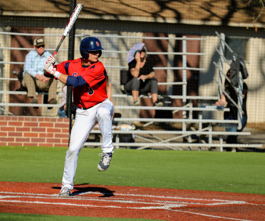 Sophomore+Daniel+Teasley+looks+the+bat+on+the+ball+in+their+loss+Thursday+to+Laney+College.