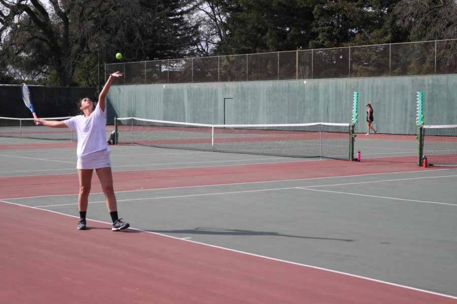 Second-year Elissa Papale serves during her singles victory Tuesday.