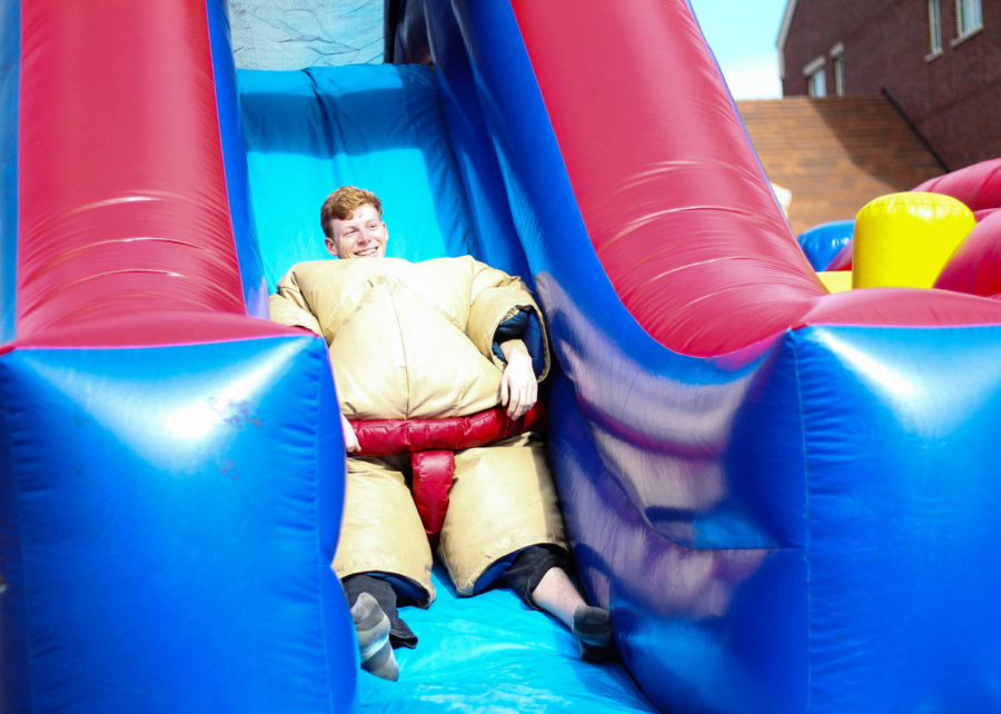 Riley Anderson, aeronautics major, attempts to beat the high score in the time trial jump house after sumo-wrestling for the Love Club event in the quad on Feb. 14.