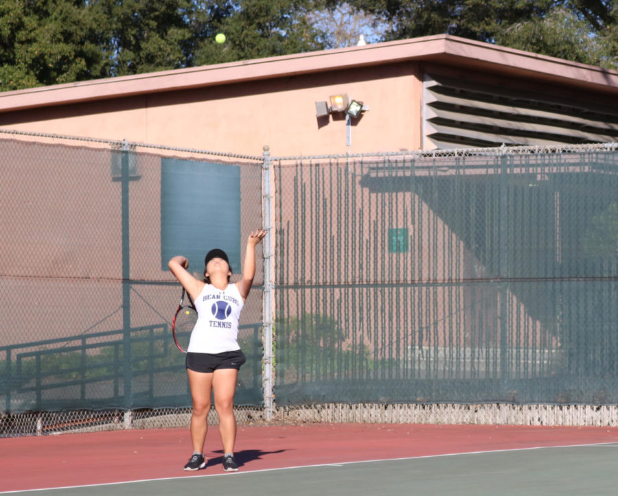 Second-year Thu Dang serves during her 6-0/6-0 win on against Foothill College Tues.