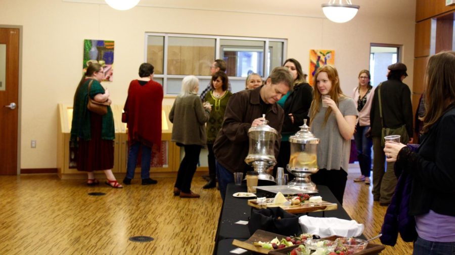 Gallery visitors enjoy complimentary refreshments.