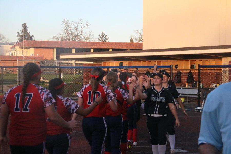 Both teams meet at home plate after the game.