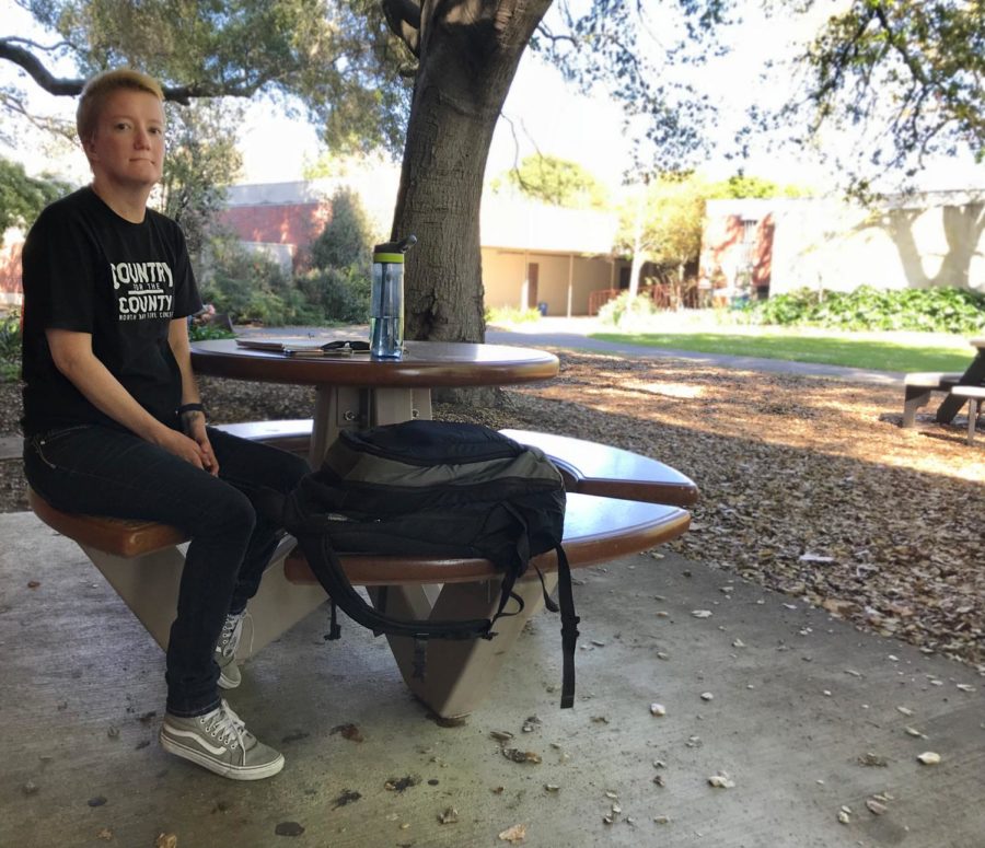 This lop sits at a table.