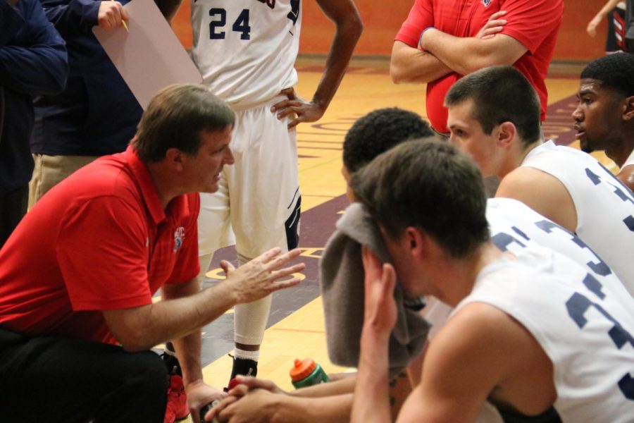 Head+coach+Craig+McMilian+focuses+his+team+during+a+timeout.