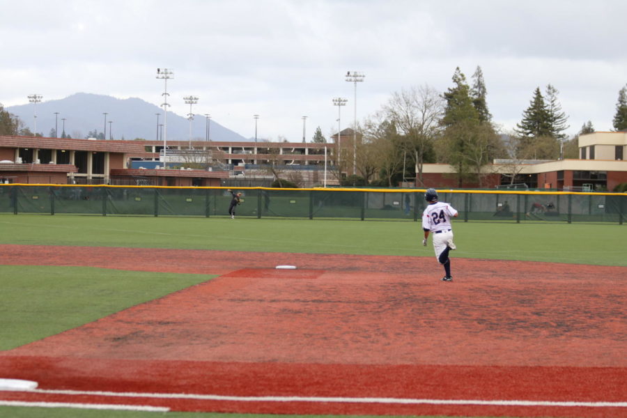 Second-year outfielder Blake Berry round first after hitting a RBI double.